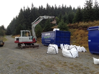 Large dumpy bags packed into skips ready for transportation to Dove Stone