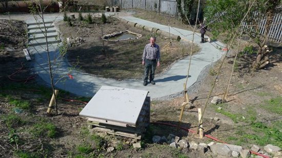 A view back the other way with path and pond established.