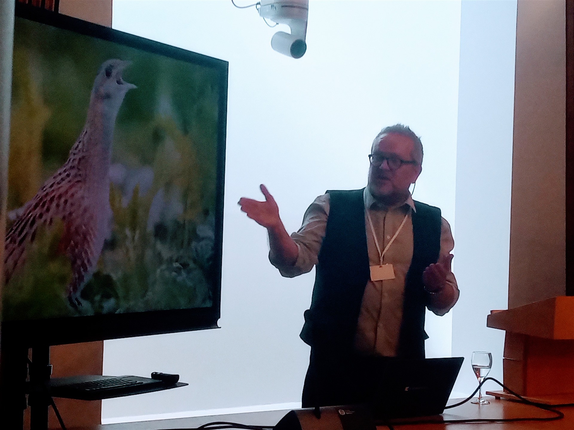  RSPB Scotland's Paul Walton is delivering a presentation beside a screen showing a Corncrake.