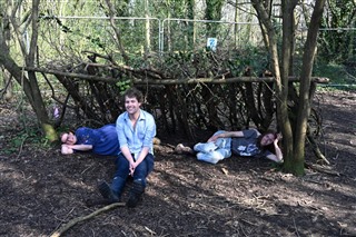 Members of the NCCB project lounging in woodland