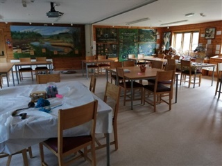 Tables, chairs and colourful posters of nature fill a classroom at a local nature reserve.