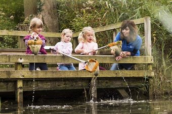 children taking part in pond dipping