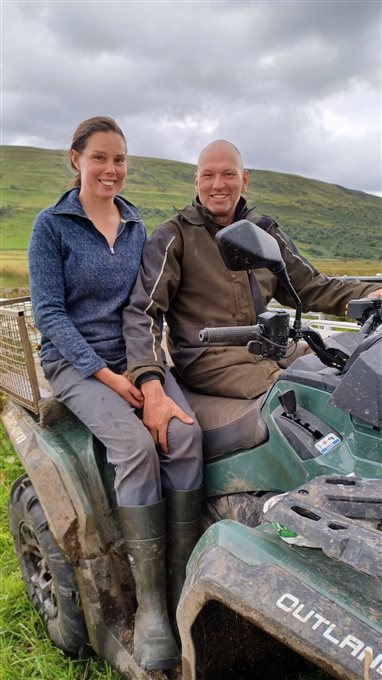  Image shows Rebecca and Ian, sitting on their quad bike