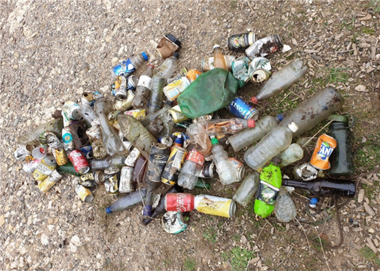 pile of litter from drinks cans and bottles