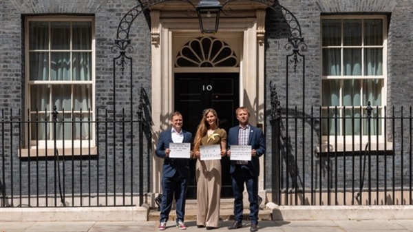 Hannah stands with Paul Goodenough of Rewriting Extinction and Jeff Knott from RSPB outside Number 10 Downing Street with her petition hand-in