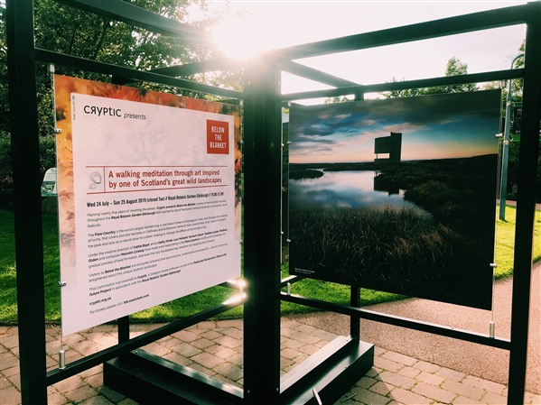 An informational welcome board and a photo of RSPB Forsinard Flows