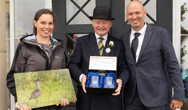 Rebecca Dickens (left) and Ian Bell (right) being awarded the Farmland Curlew Award
