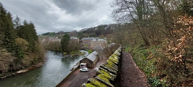 A view of the mill at New Lanark and the River Clyde, from the path towards the Falls of Clyde.