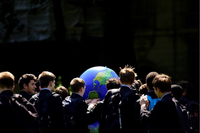 School group playing a game using an inflatable earth at The Time Is Now Mass Lobby, Westminster, London (2019) – Ben Andrew (rspb-images.com)